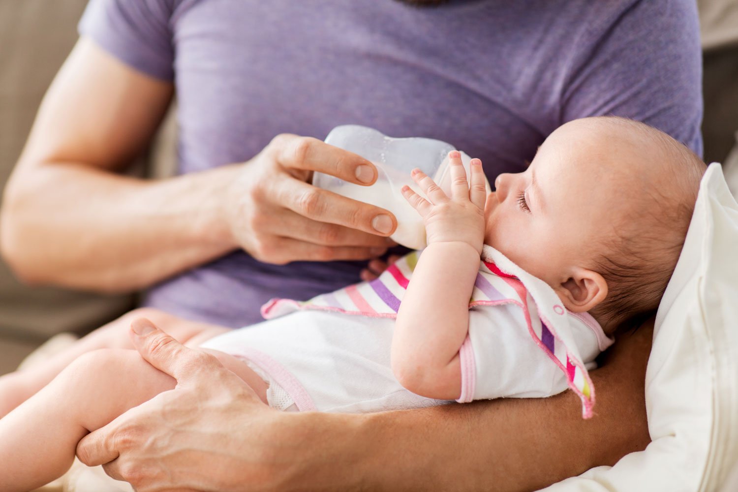 Mom bottle feeding baby